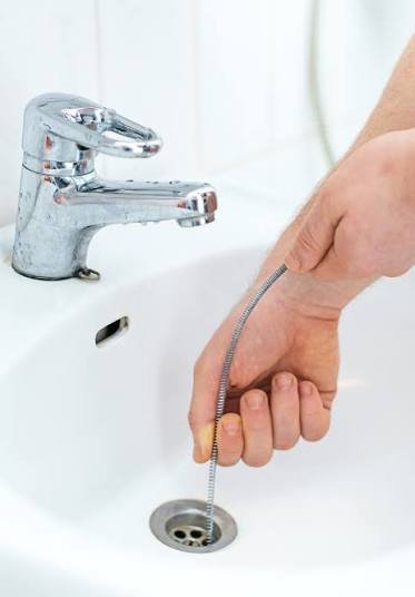How to Unclog a Drain Without Calling a Plumber (2026 Guide)
